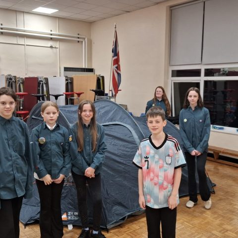 13th Howdon Scouts standing proudly in front of a tent they pitched